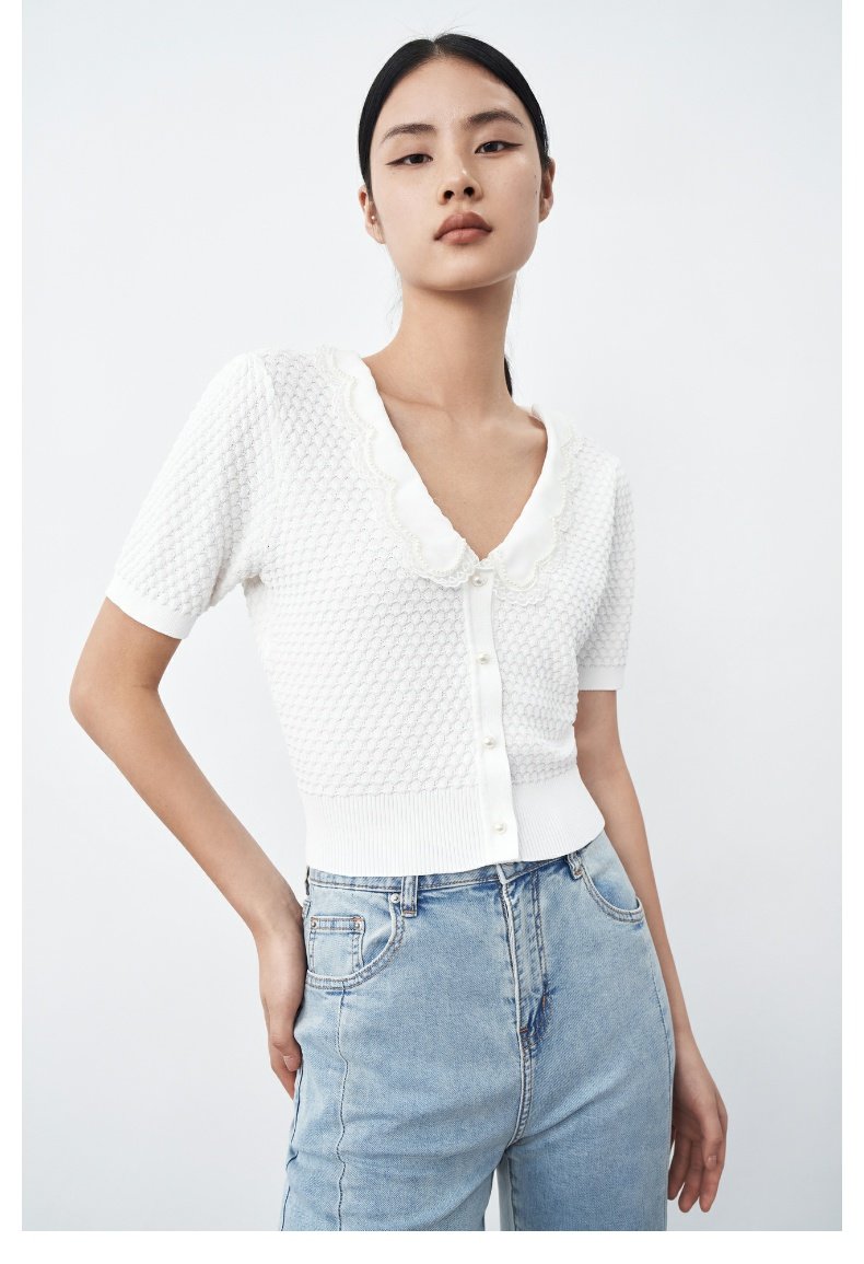 Knitted white women short-sleeved top with button